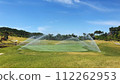 sprinkle on the golf course green 112262953