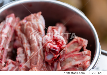 Bone and cartilage waste from butcher shops - dog food Bone and cartilage waste from butcher shops - dog food 112263213