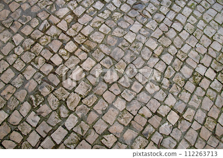 Paved pavement close up, granite cobblestoned pavement background, abstract stone pavement texture 112263713