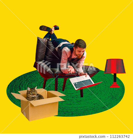 Contemporary art collage. Man in business attire lying on chair using laptop, with cute cat in box and lamp on rug. 112263742