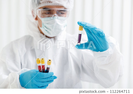 Researchers test blood samples in the laboratory. Researchers are inventing vaccines to treat COVID-19 virus. 112264711