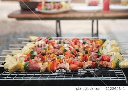 Assorted delicious barbecue with meat and vegetable on the stove Assorted delicious barbecue with meat and vegetable on the stove 112264841