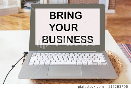 Bring your business online. text on laptop against office background Bring your business online. text on laptop against office background 112265706