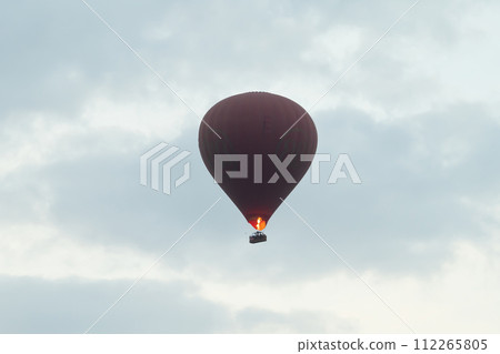 Balloons flying over Burmese temples of Bagan City from a balloon, unesco world heritage with forest trees, Myanmar or Burma. Tourist destination. 112265805