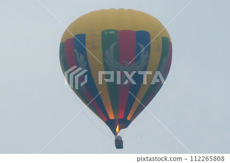 Balloons flying over Burmese temples of Bagan City from a balloon, unesco world heritage with forest trees, Myanmar or Burma. Tourist destination. 112265808