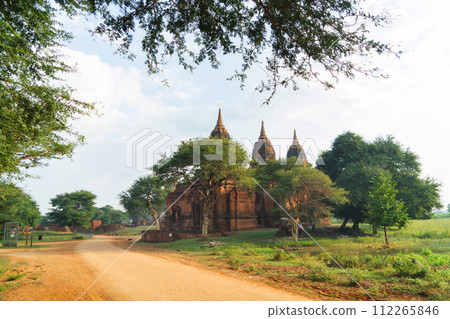 Burmese temples of Bagan City from a balloon, unesco world heritage with forest trees, Myanmar or Burma. Tourist destination. Burmese temples of Bagan City from a balloon, unesco world heritage with forest trees, Myanmar or Burma. Tourist destination. 112265846
