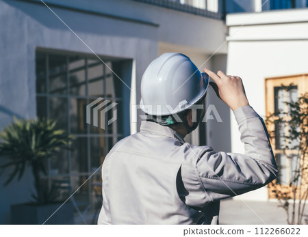 Construction worker inspecting building Construction worker inspecting building 112266022