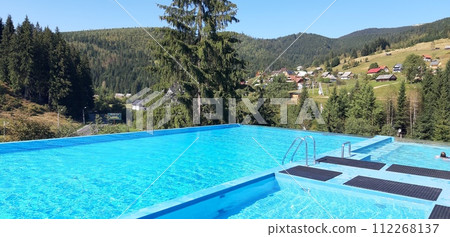 Pool with blue water in the carpathians Pool with blue water in the carpathians 112268137