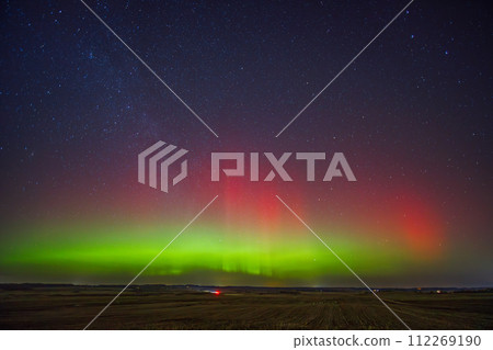 Northern lights - Aurora borealis dancing in the night sky. Northern lights - Aurora borealis dancing in the night sky. 112269190
