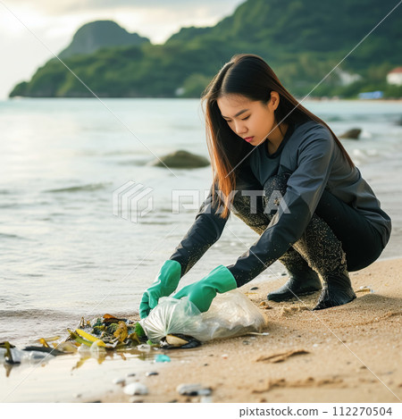 AI-generated content. An Asian girl volunteers to collect plastic trash on beach, showing her commitment to cleaning up the environment and preserving the ocean. Day of protection of earth and water 112270504