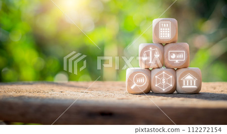 Accounting concept, Wooden block on desk with accounting icon n virtual screen. Accounting concept, Wooden block on desk with accounting icon n virtual screen. 112272154