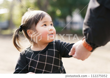 Girls playing in the park 112275052