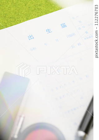 Birth registration (focus on the letters on the birth registration) 112276783