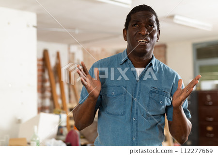 Portrait of disappointed man in apartment during repair works 112277669