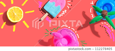 Summer concept with a flamingo float, lemon sunlight and a popsicle 112278405