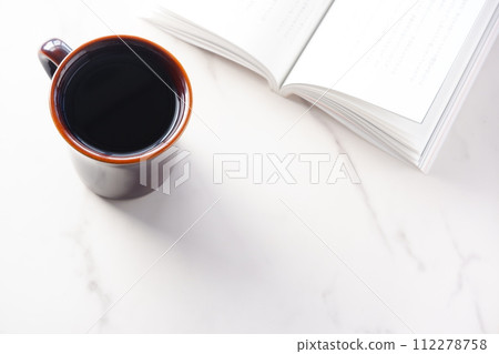 Image of reading while drinking coffee Image of reading while drinking coffee 112278758