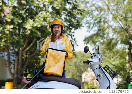 Courier recording voice message after delivering order to customer Courier recording voice message after delivering order to customer 112279755