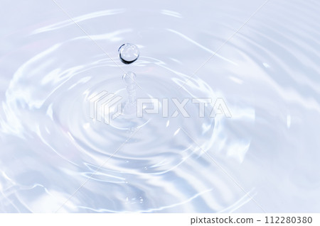 Drops of water falling on the surface of the water. 112280380