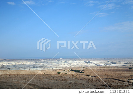 Waterless landscape of the Judea desert, view from Masada towards the Dead Sea, Israel Waterless landscape of the Judea desert, view from Masada towards the Dead Sea, Israel 112281221