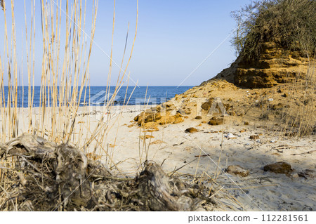 View of the beautiful landscape with the beach and sand dunes, the landscape of the coast. View of the beautiful landscape with the beach and sand dunes, the landscape of the coast. 112281561