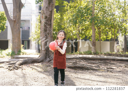 A girl playing with a ball A girl playing with a ball 112281837