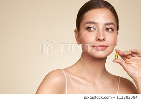 Beautiful Girl With Pill With Cod Liver Oil Omega-3 112282384