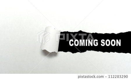 Ripped paper with 'coming soon' text 112283290