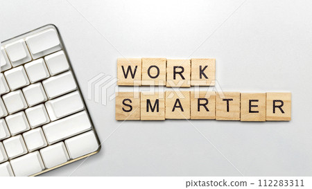 The row of wooden cubes with 'work smarter' text 112283311