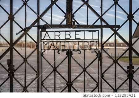 DACHAU, GERMANY Work sets you free sign on gates at Dachau Concentration Camp DACHAU, GERMANY Work sets you free sign on gates at Dachau Concentration Camp 112283421