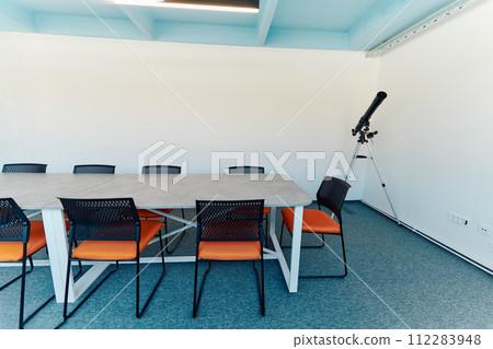 Photo of a modern office where programming, digital marketing and web design projects are done. Office with modern furniture and glass office Photo of a modern office where programming, digital marketing and web design projects are done. Office with modern furniture and glass office 112283948