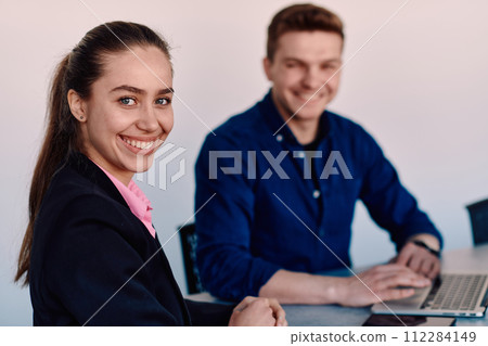 A business leader in a suit conversing with her worker in the IT industry about new business projects and existing business problems 112284149