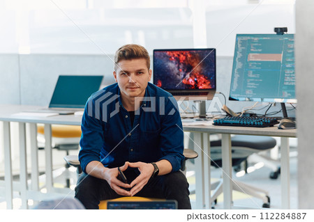 Programming. Man Working On Computer In IT Office, Sitting At Desk Writing Codes. Programmer Typing Data Code, Working On Project In Software Development Company 112284887
