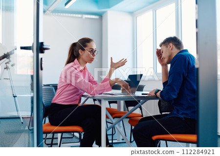 A furious business director of a startup office berating her employee for business mistakes and errors 112284921