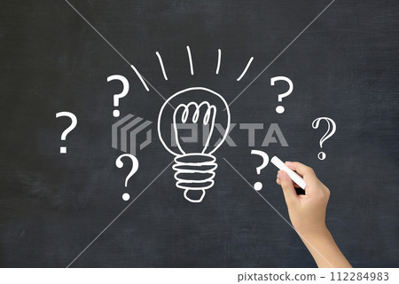 An image of a child's inspiration - a child's hand drawing a light bulb and the Hatena mark 112284983