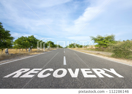 'Recovery' text on the asphalt road 'Recovery' text on the asphalt road 112286146