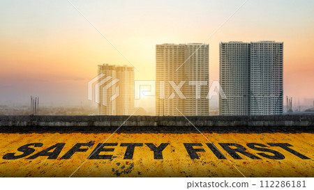 'Safety first' text on the asphalt road 'Safety first' text on the asphalt road 112286181