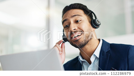 Laptop, problem solving and business man in call center with headset for customer support or service. Smile, computer and consulting with happy employee working in tech agency for contact us online 112286979