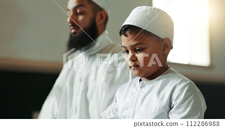 Muslim, praying and man with child in mosque for learning, religious education and worship or prayer. Islamic community, religion and person and kid for Ramadan Kareem, Eid Mubarak and teaching Quran 112286988