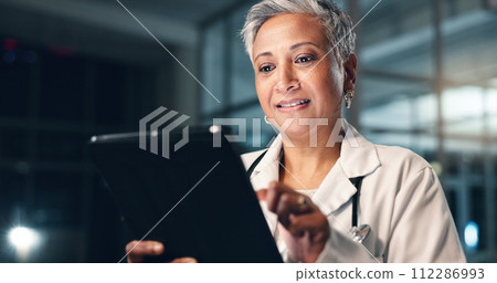 Doctor, mature woman and happy with tablet in night, typing or smile for results, meme or notification in hospital. Senior nurse, digital touchscreen or funny video with click, scroll or social media Doctor, mature woman and happy with tablet in night, typing or smile for results, meme or notification in hospital. Senior nurse, digital touchscreen or funny video with click, scroll or social media 112286993