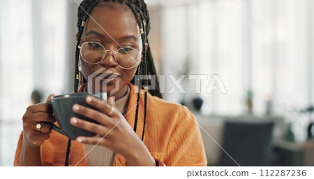 Calm, cup of coffee and black woman in the living room of her modern apartment in the morning. Peaceful, mug and young African female person drinking caffeine or latte in her home on weekend. 112287236