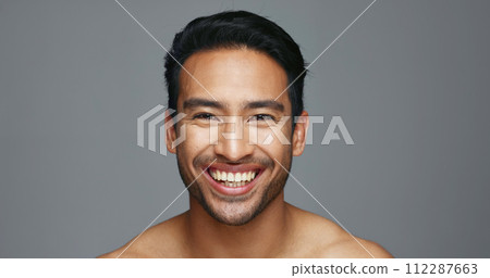 Man, face and natural beauty with hygiene and cosmetics, headshot and skincare isolated on grey background. Mockup space, portrait and clean dermatology, smile with grooming and self care in studio 112287663