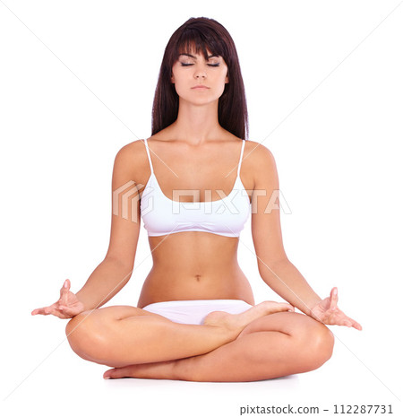 Woman, yoga and meditation in studio for peace, calm and mental health with wellness and mindfulness. Yogi relax with lotus pose for spiritual, holistic and chakra practice on a white background 112287731
