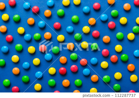 colorful candies as background top view. Seamless pattern with candy. Many sweet candies close-up 112287737