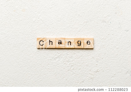 CHANGE word written on wood block. CHANGE text on cement table for your desing, concept CHANGE word written on wood block. CHANGE text on cement table for your desing, concept 112288023
