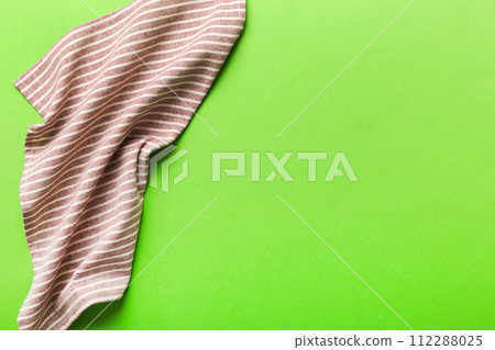 top view with red empty kitchen napkin isolated on table background. Folded cloth for mockup with copy space, Flat lay. Minimal style top view with red empty kitchen napkin isolated on table background. Folded cloth for mockup with copy space, Flat lay. Minimal style 112288025