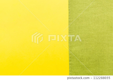 top view with green kitchen napkin isolated on table background. Folded cloth for mockup with copy space, Flat lay. Minimal style top view with green kitchen napkin isolated on table background. Folded cloth for mockup with copy space, Flat lay. Minimal style 112288035