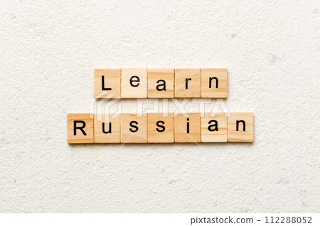 learn russian word written on wood block. learn russian text on table, concept 112288052