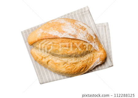 Fresh Homemade Whole Wheat Bread. bread on napkin isolated on white background, fresh bread top view 112288125