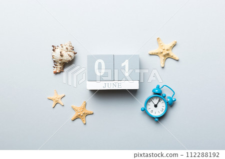 June 1th. Image of june 1 wooden calendar on colored background. Summer day. Empty space for text June 1th. Image of june 1 wooden calendar on colored background. Summer day. Empty space for text 112288192