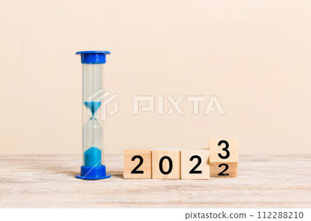New Year 2023 sand timer. Resolution, time, plan, goal, motivation, reboot, countdown and New Year holiday concepts. Hourglass with number 2023 112288210